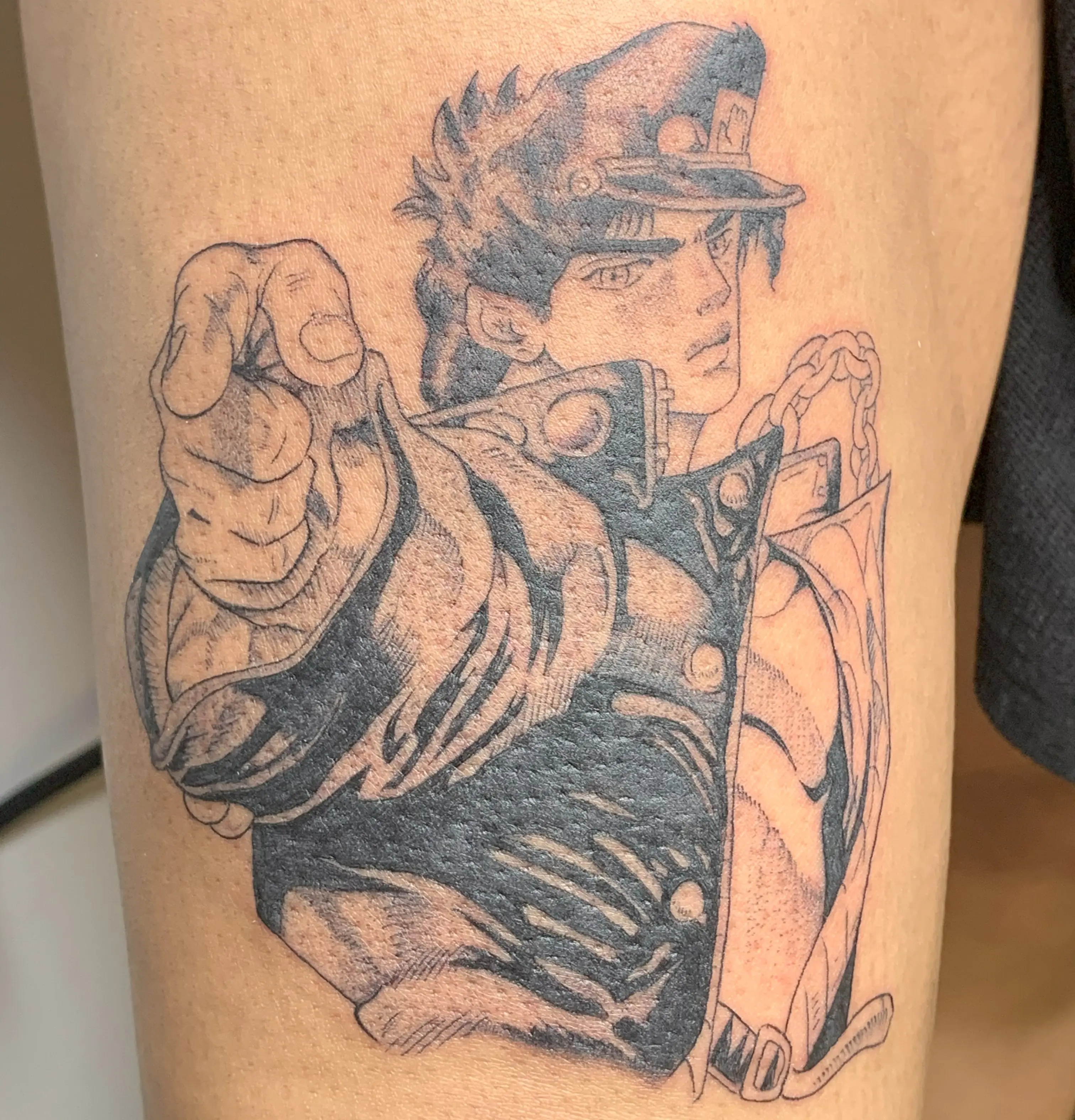 Anime-inspired tattoo with crisp linework and high-contrast shading by Raven Inkwork