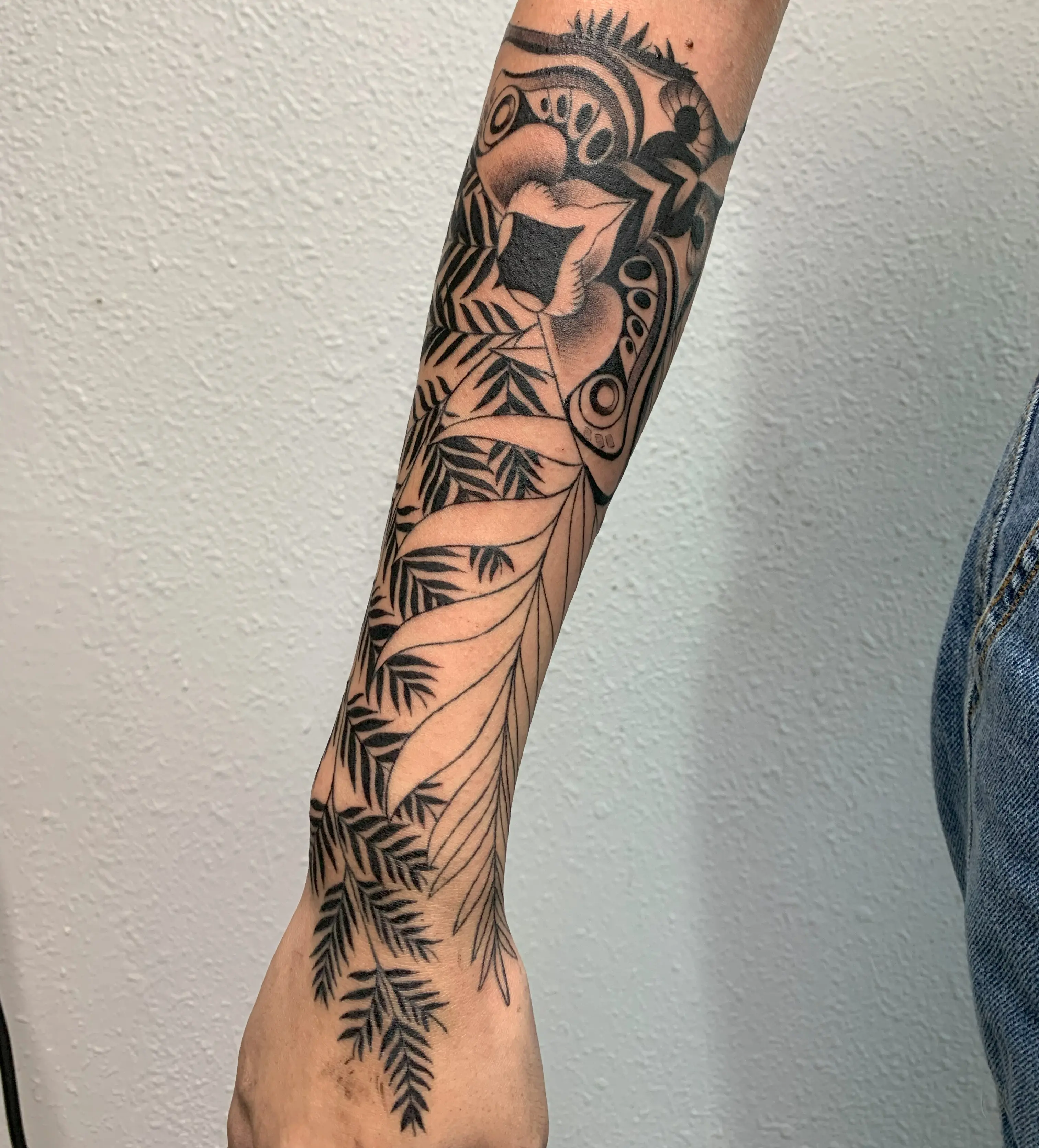 Bold dark-style tattoo piece with dramatic blackwork contrast