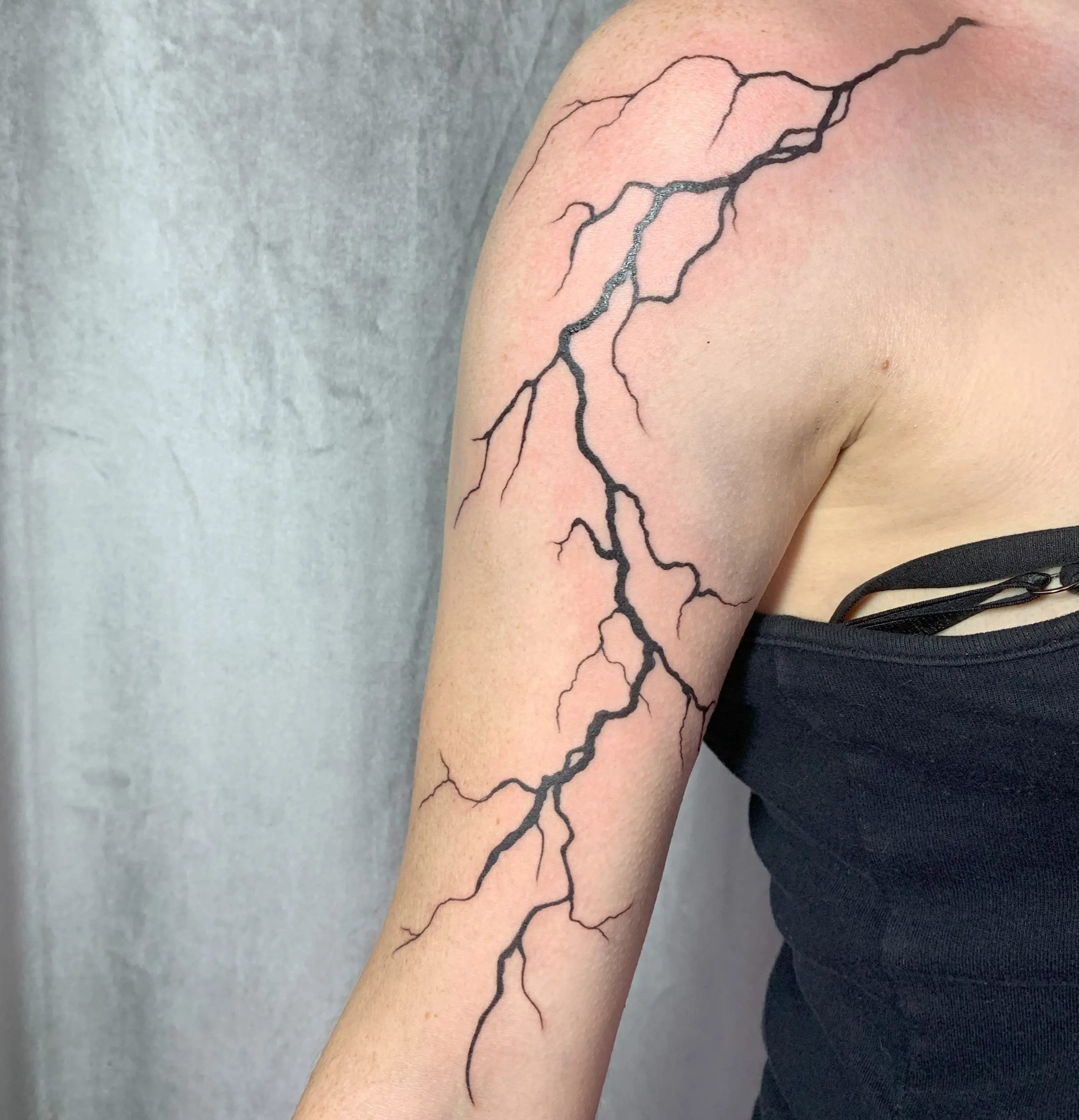 Dark aesthetic tattoo with layered shading and strong silhouette