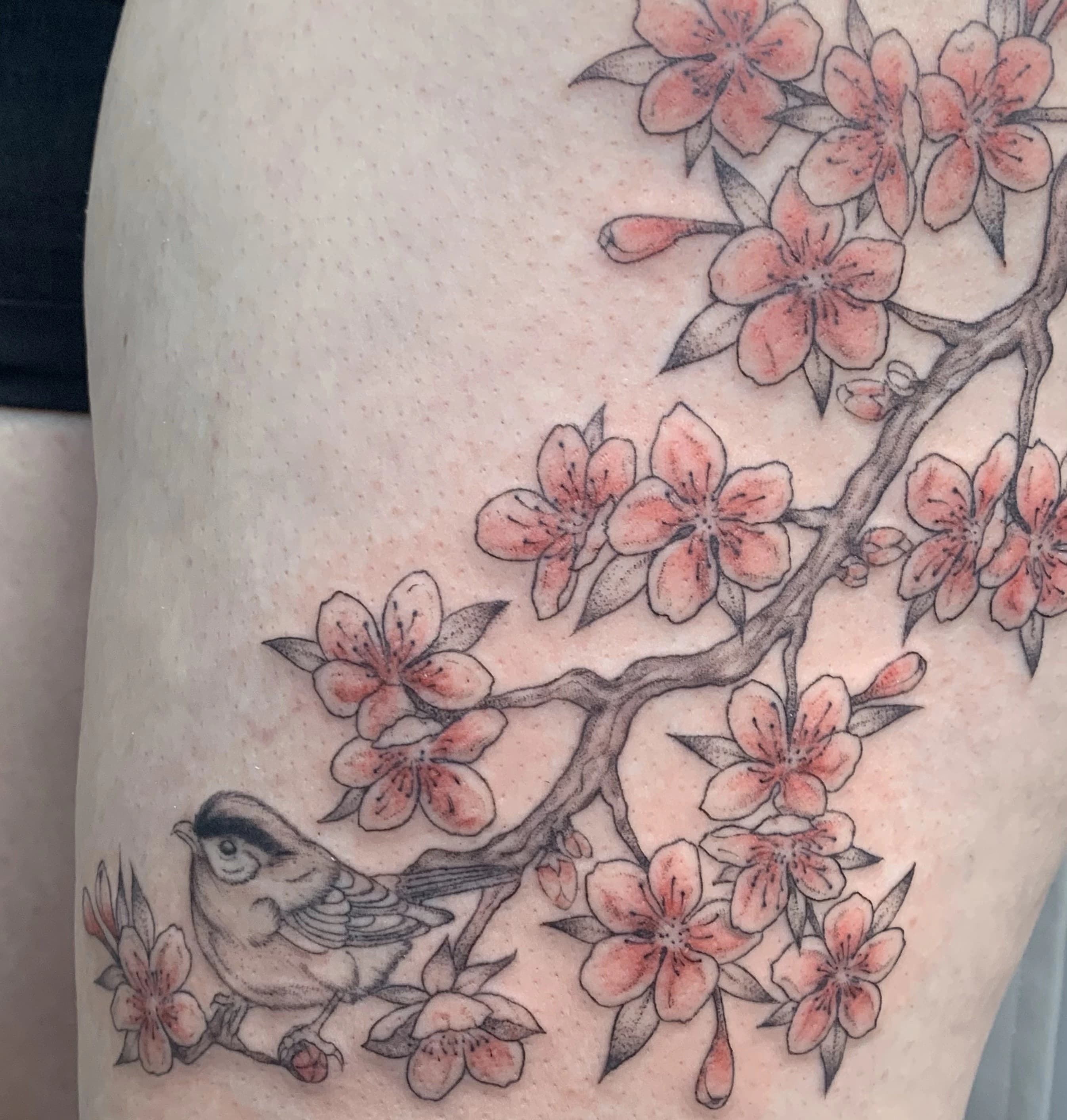Illustrative tattoo featuring wildlife-inspired composition and varied line weights