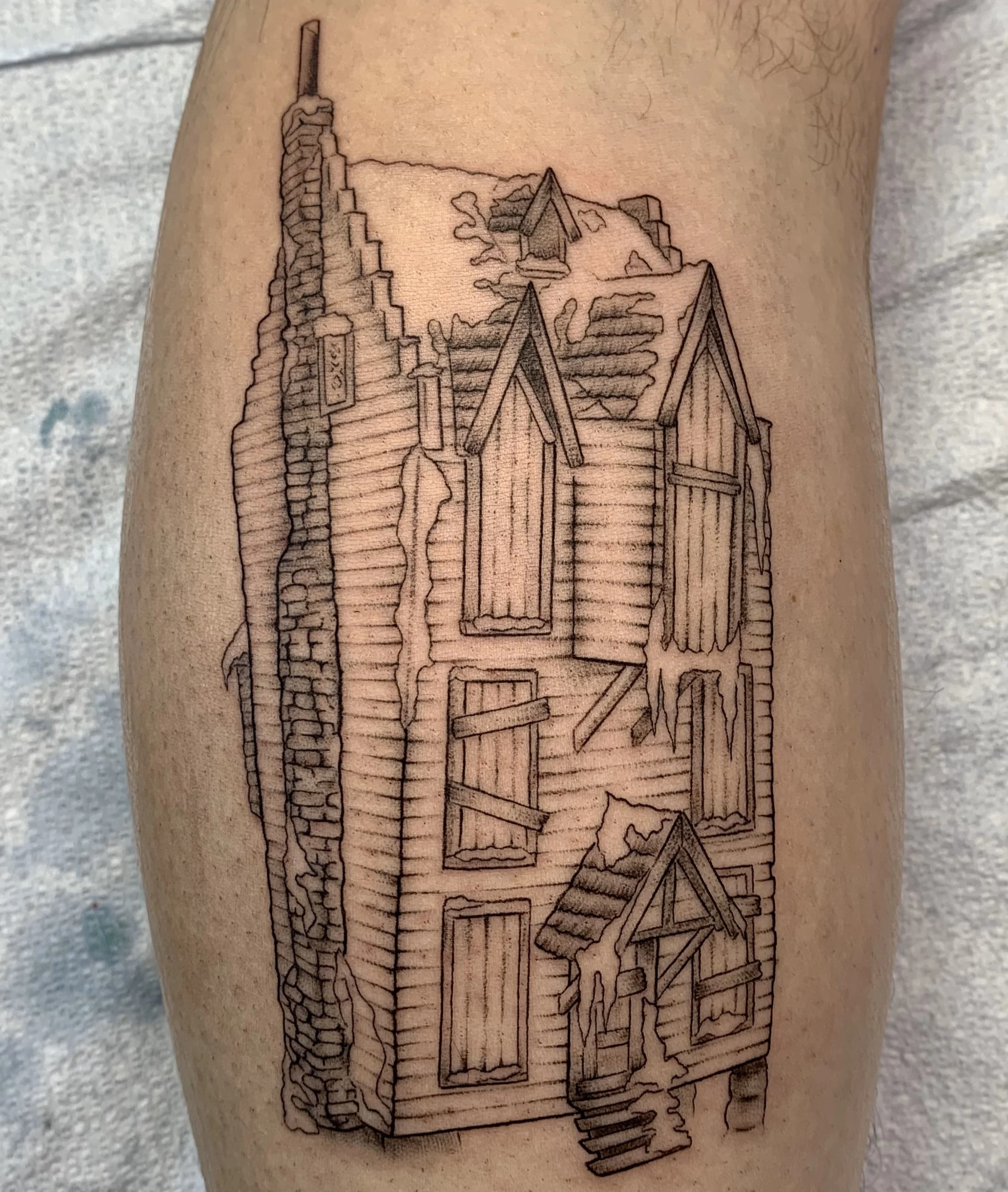 Custom illustrative tattoo with textured shading and narrative visual style