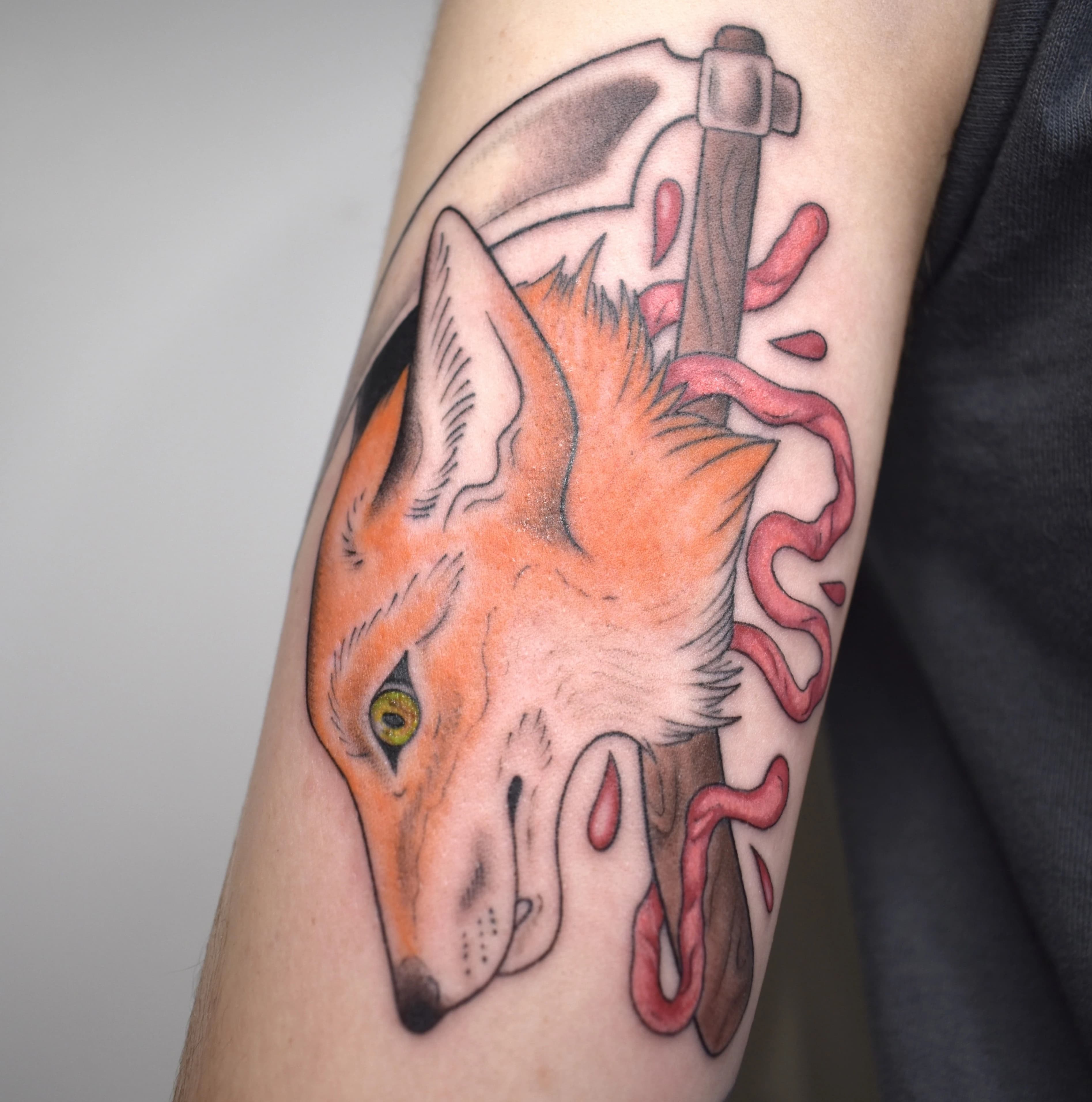 Neo-traditional tattoo with bold outlines, saturated color, and ornamental detail