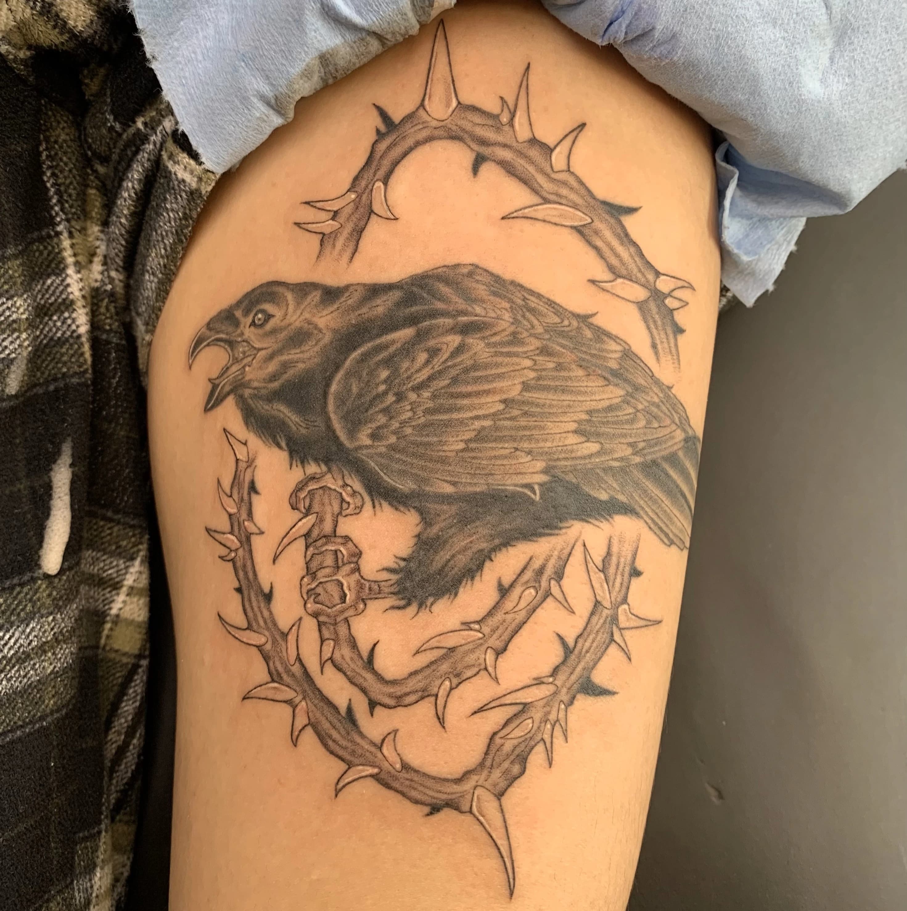 Neo-traditional tattoo artwork by Raven Inkwork with strong contrast and flow